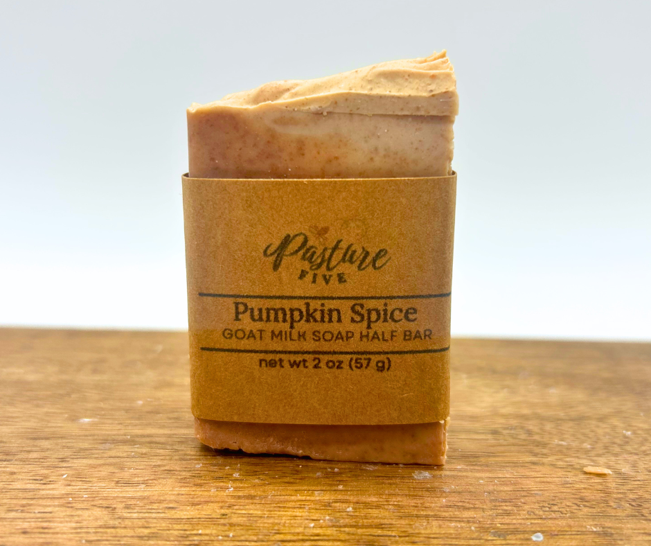 One 2oz bar of Pumpkin Spice. One with a wrap on a wood board.