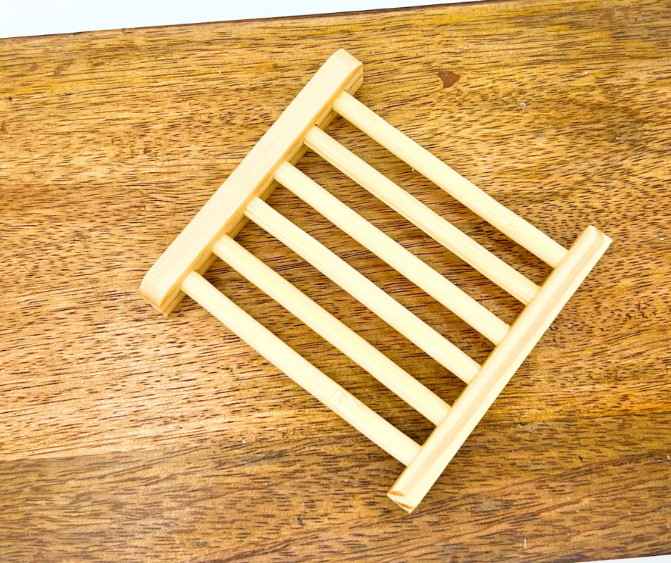 Wooden soap rack on a wooden surface