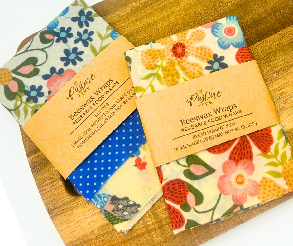 Beeswax wraps with floral  patterns on a wooden board.