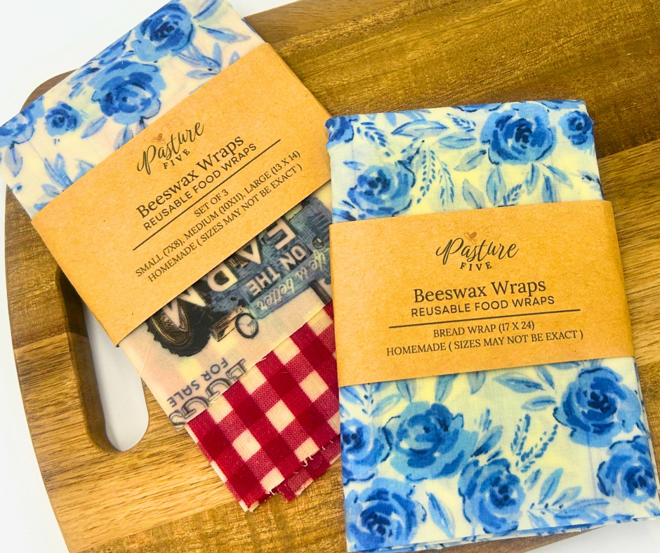Beeswax wraps with floral and checkered patterns on a wooden surface
