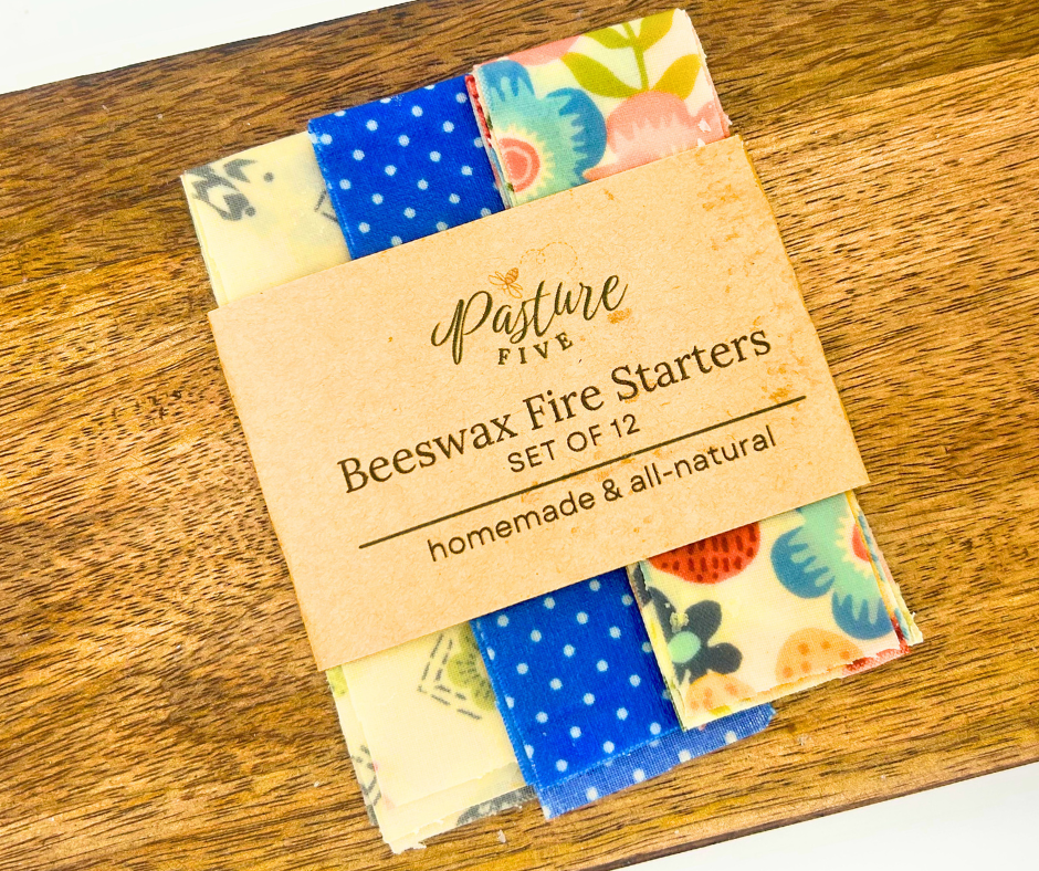 Set of beeswax fire starters with colorful fire starters on a wooden surface