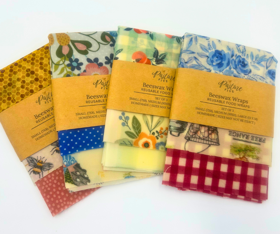 Set of colorful beeswax wraps with patterned designs on a white background