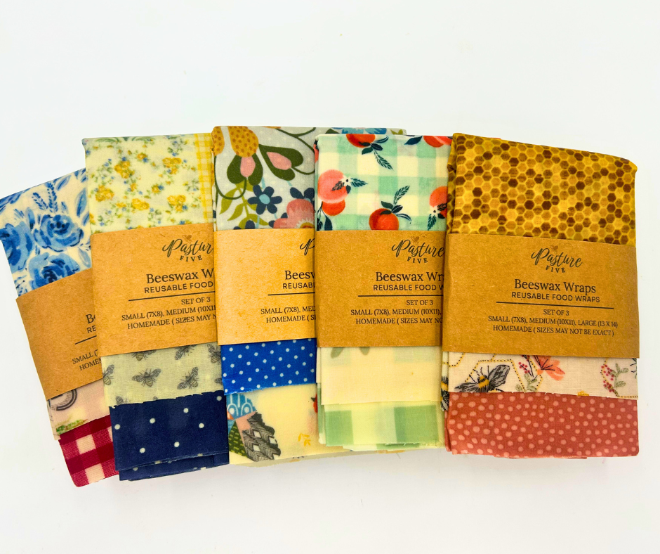 Set of colorful beeswax wraps with patterned designs on a white background