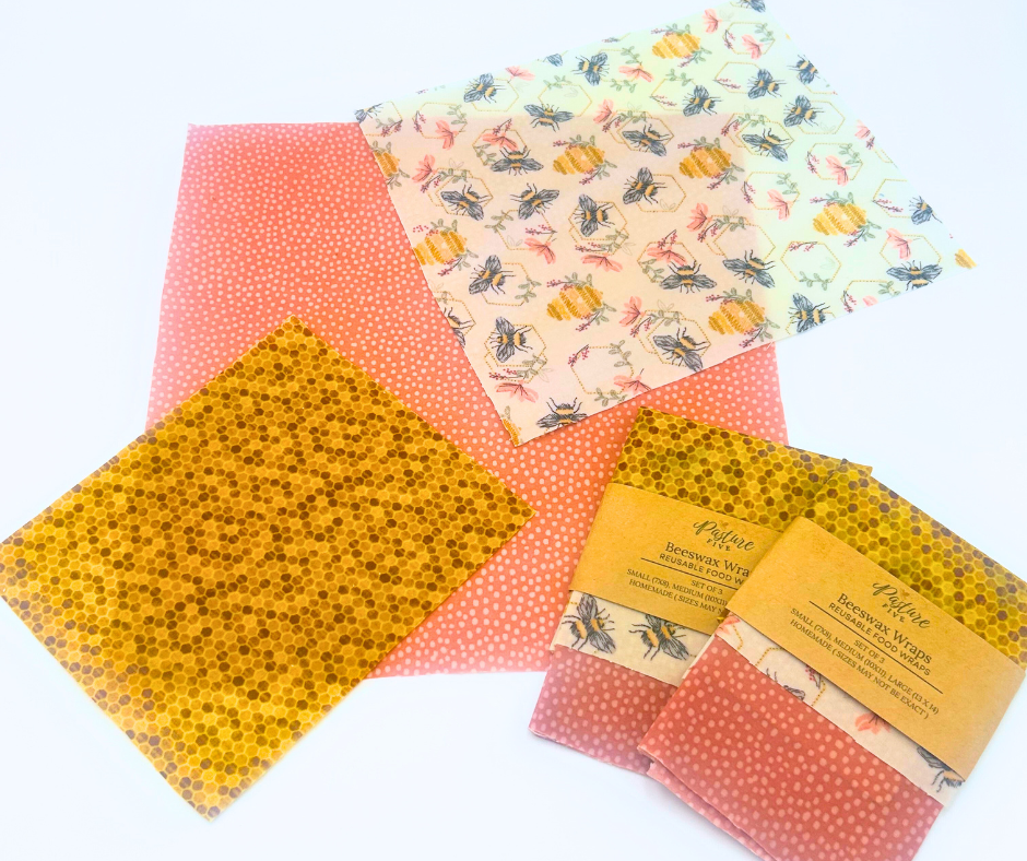 Set of reusable wax wraps with various honey bee patterns on a white background