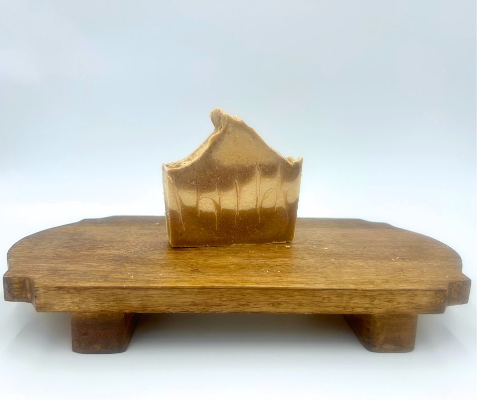 One bar of Rustic Sandalwood soap on wooden stand with a white background