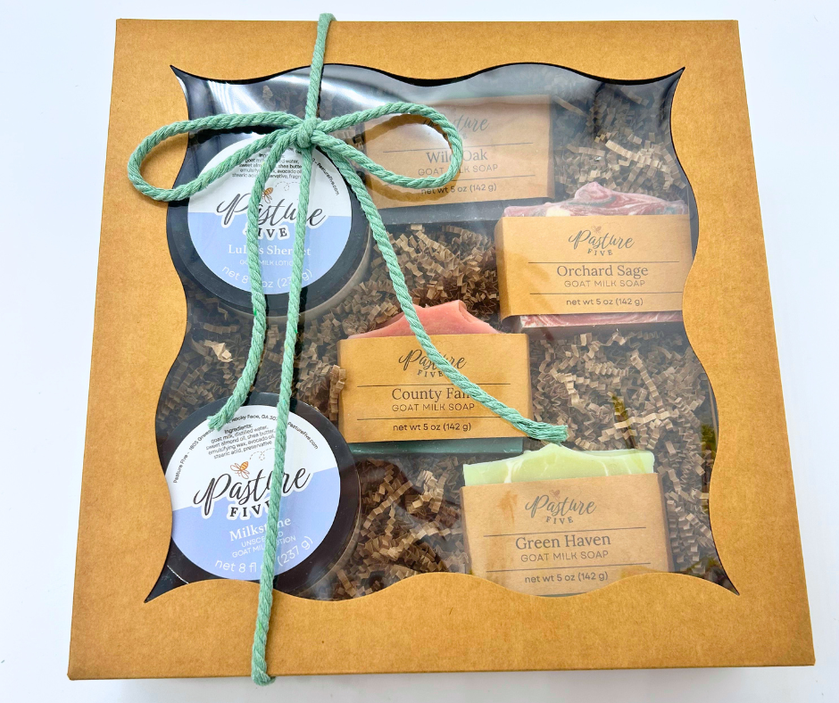 The Christmas Family Farm Box with a bow. 4 Full-Size Goat Milk Soaps + 2 — 8 oz Goat Milk Lotions