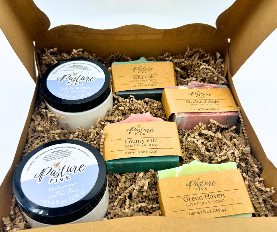 The Christmas Family Farm Box with a bow. 4 Full-Size Goat Milk Soaps + 2 — 8 oz Goat Milk Lotions