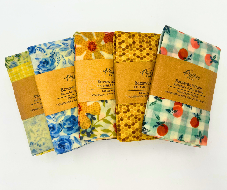 Set of beeswax wraps with colorful patterns on a white background