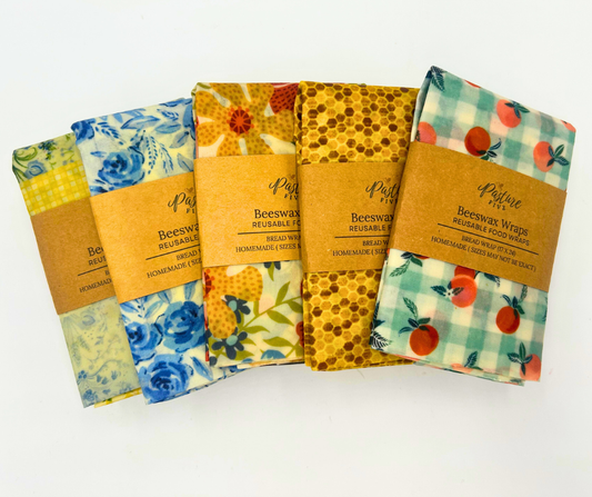 Set of beeswax wraps with colorful patterns on a white background