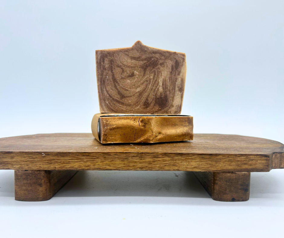 2 Full bars of Cashmere & Cocoa on a wood board. 