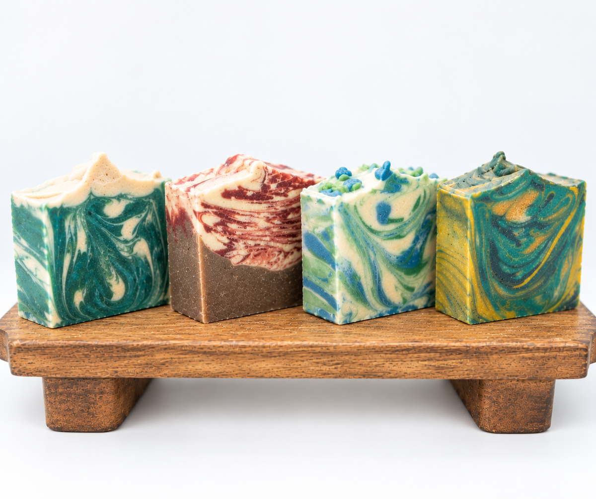 Four Christmas Soaps on a wood board 
