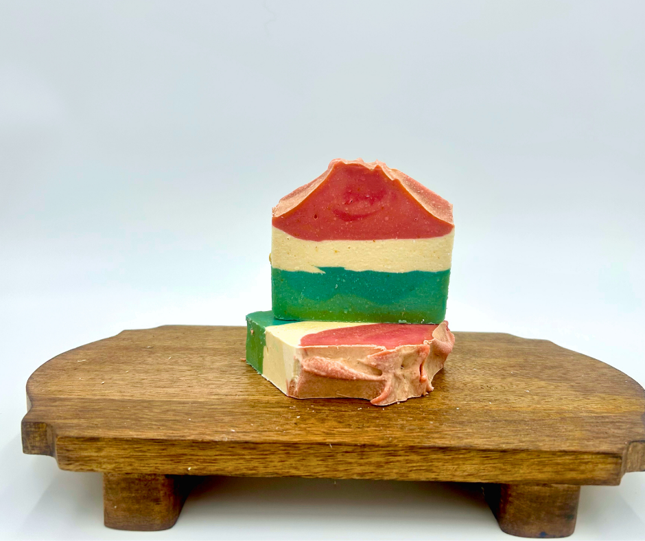 layered soap on a wooden stand with a white background