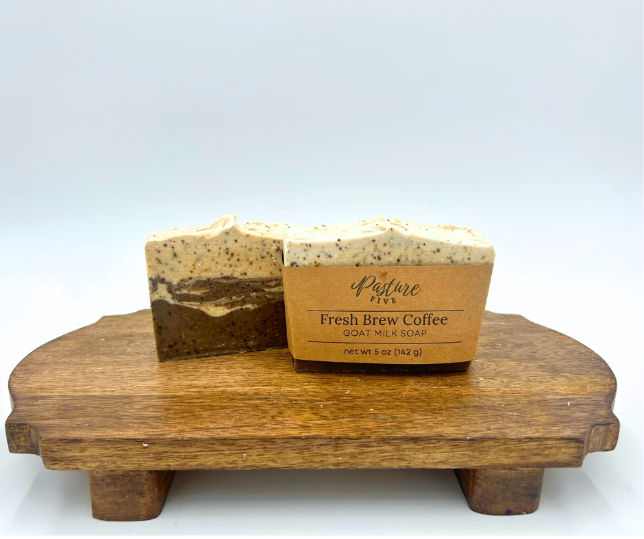 Fresh Brew Coffee Soap on a brown platform, One soap wrapped with label and one not. Cream and Brown 