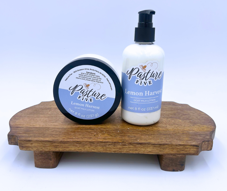 Two Lemon Harvest Lotions on a wooden stand with a white background