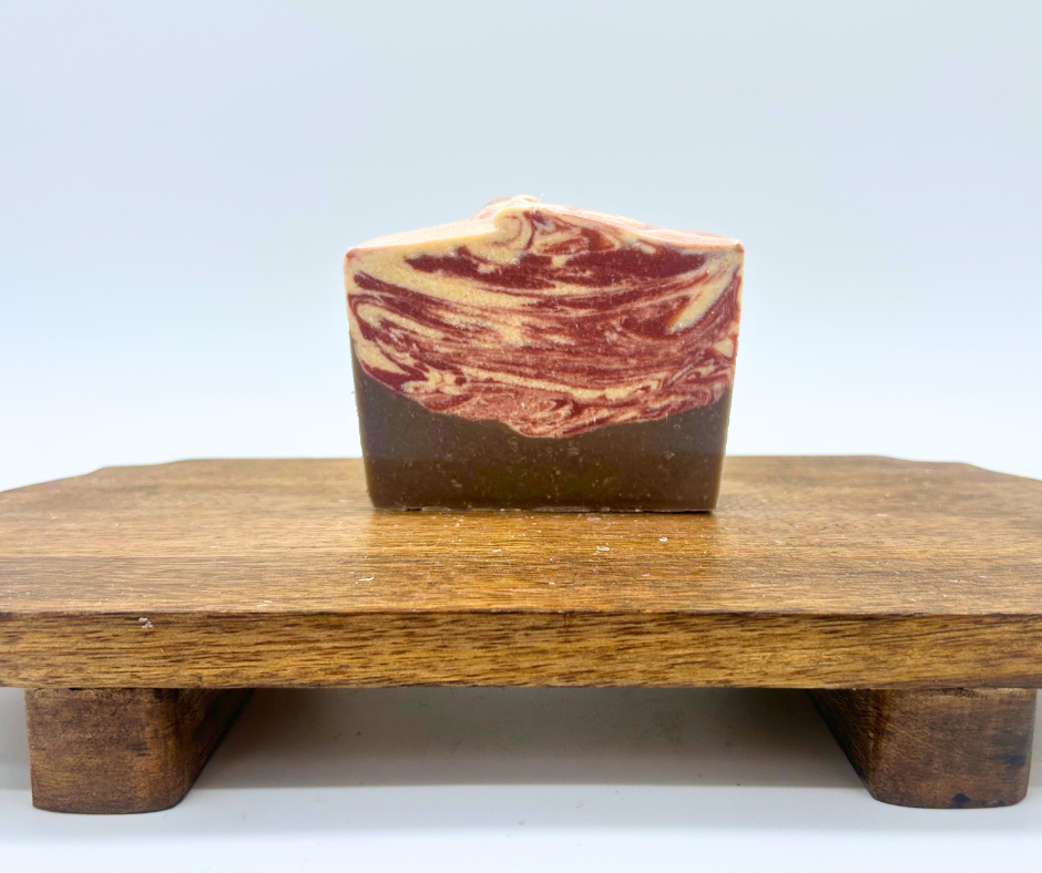 One bar of Peppermint Cocoa on a wood board. 
