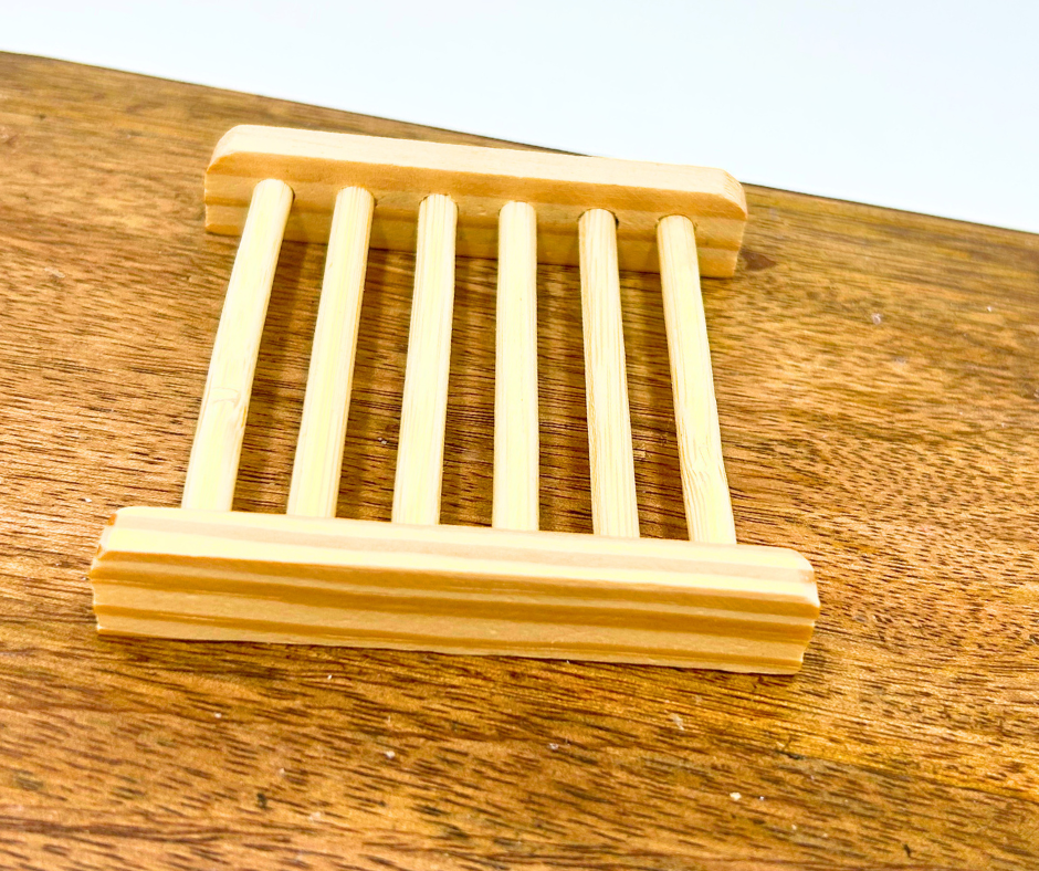 Wooden soap dish on a wooden surface