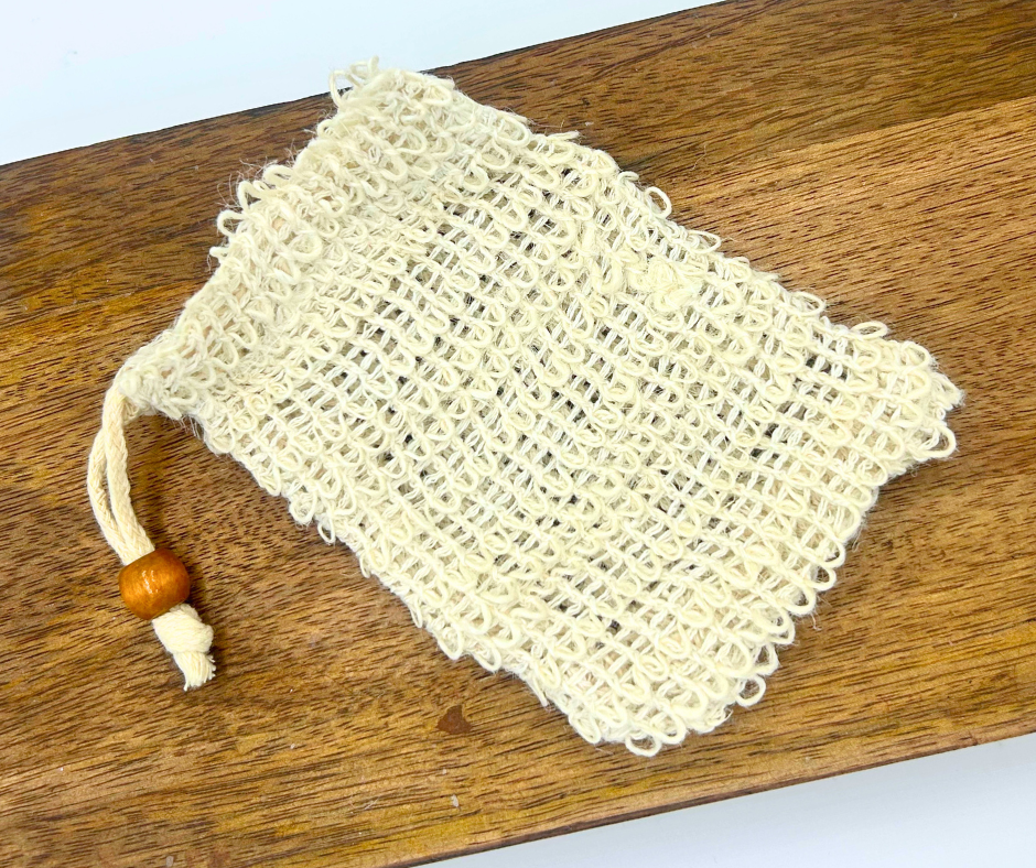 A Soap Saver Bag on a  wooden surface.