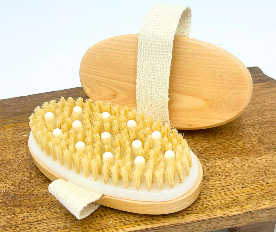 Body scrubber with wooden handle on a wooden surface