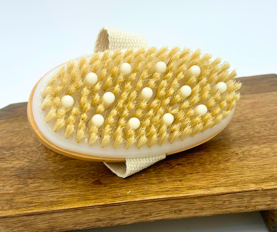 Gentle touch brush with soft bristles on a wooden surface