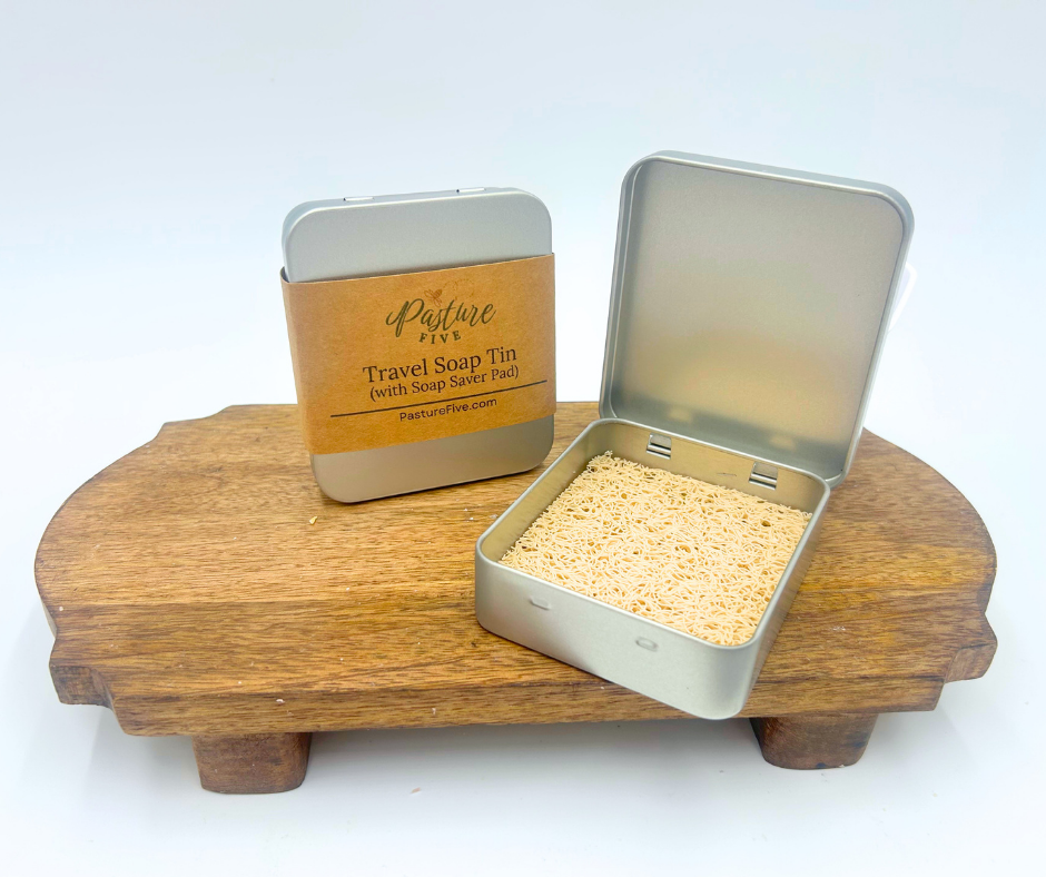 Travel soap tin with wooden stand and 'Pattie Five' branding on a white background