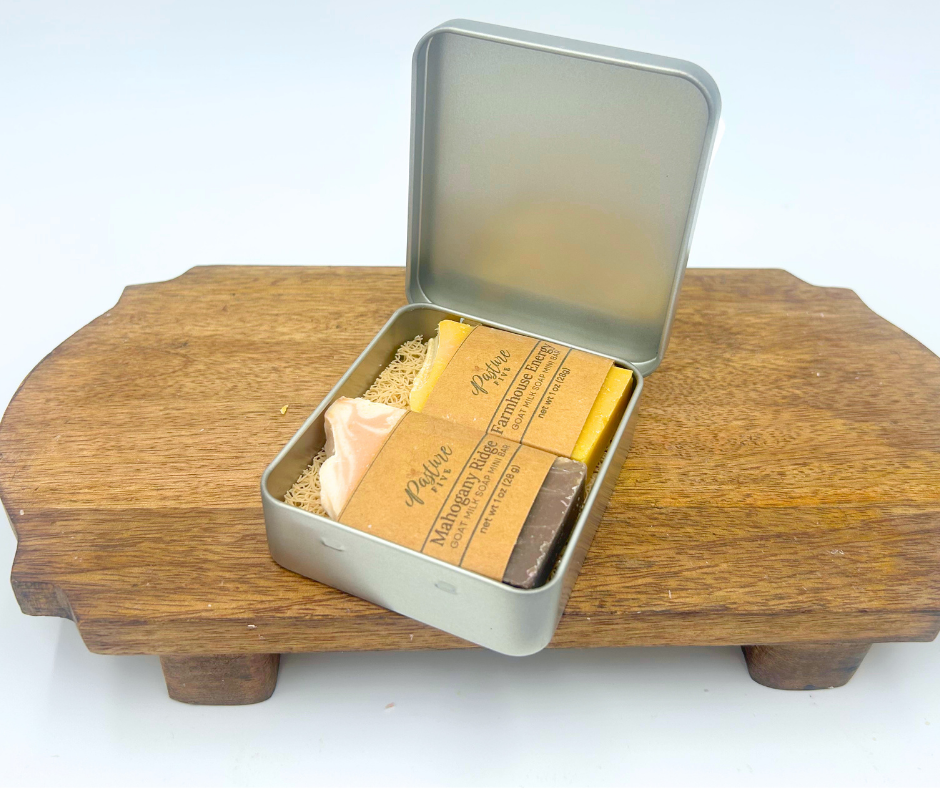 Metal tin with soap bars on a wooden stand