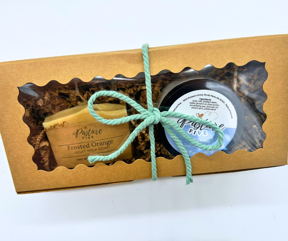 A gift box with a full soap and a jar of 8 oz goat milk lotion. With a bow. 